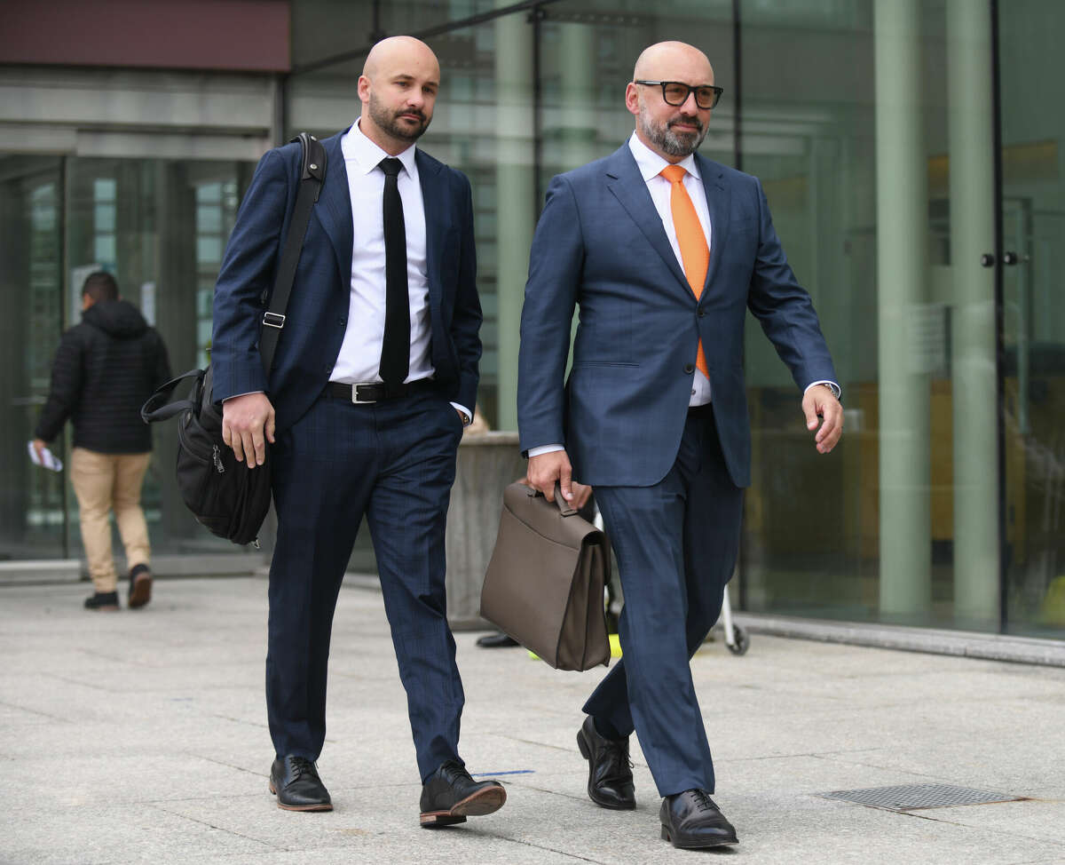 Richard Meehan, left, and Michael Meehan, the attorneys of Greenwich socialite Hadley Palmer, exit after Palmer's sentencing at the Connecticut Superior Court in Stamford, Conn. Tuesday, Nov. 29, 2022. Palmer was sentenced to one year in prison and 20 years probation Tuesday after pleading guilty to voyeurism charges.