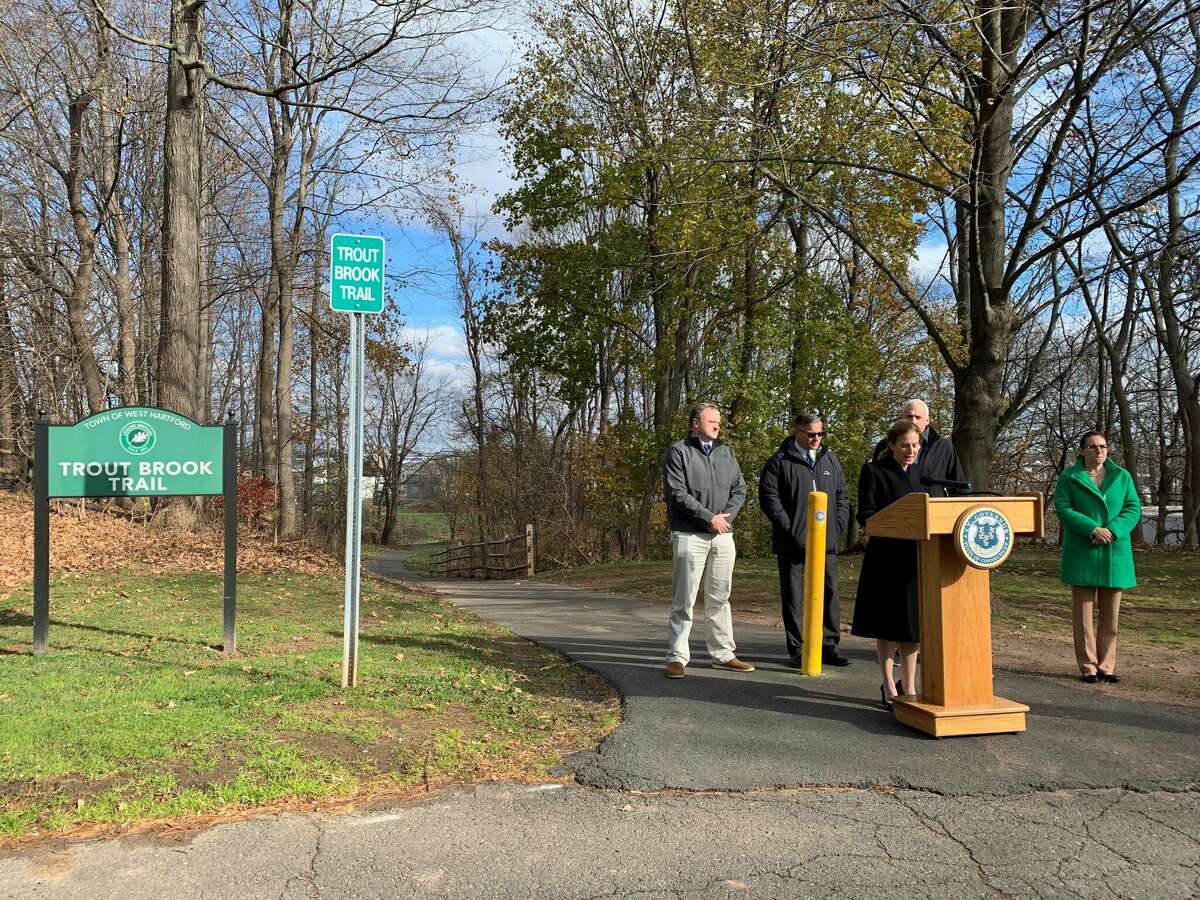 Lt. Gov. Susan Bysiewicz speaks Tuesday at an entrance to the Trout Brook Trail in West Hartford about state funding that will allow the continued expansion of the trail.