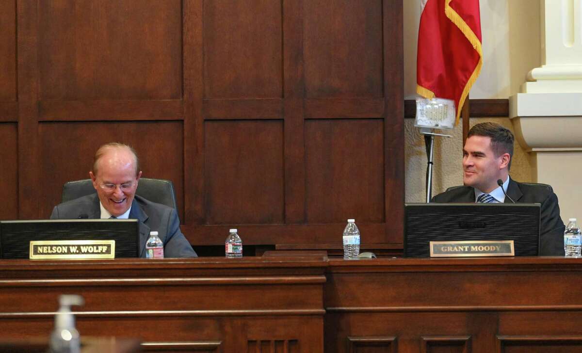 New Bexar County Commissioner Grant Moody, right, and County Judge Nelson Wolff share a light moment during a meeting to discuss the long-awaited jail evaluation conducted by American Correctional Consultants on Tuesday.