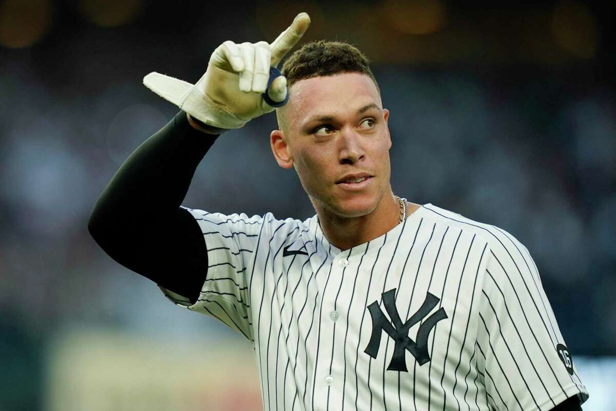 New York Yankees' Aaron Judge, right, gestures to fans after a baseball game against the Tampa Bay Rays Sunday, Oct. 3, 2021, in New York. The Yankees won 1-0. (AP Photo/Frank Franklin II)