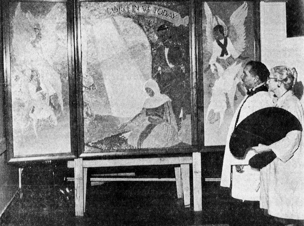 (From left) the Rev. Harold Perschbacher and Gertrude Armstrong can be seen with the triptych Armstrong painted for the Sunday school of Holy Trinity Episcopal Church. The photo was published in the News Advocate on Dec. 1, 1962.