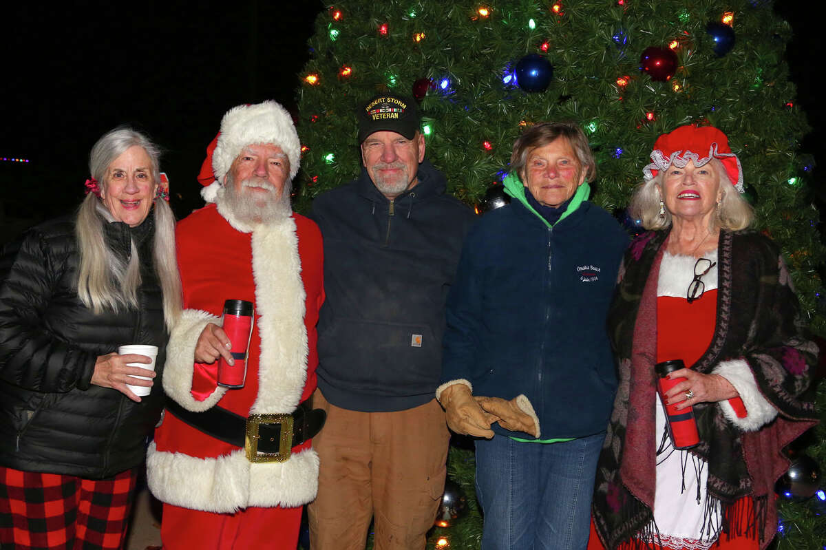Grafton Mayor Mike Morrow, center, and his wife, Lynne Morrow, stand with Santa and Mrs. Claus at the annual Grafton Christmas Tree Lighting Ceremony Nov. 25.