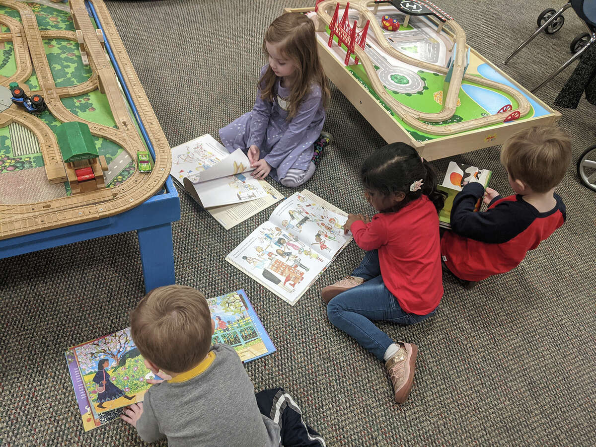 Children have a playtime after a storytime at the Norwalk Library.  