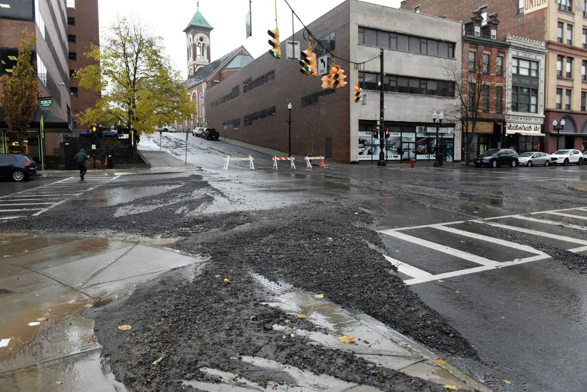 North Pearl is covered with debris after a water-main broke several places beginning along Pine St. on Wednesday, Nov. 30, 2022, in Albany, N.Y.