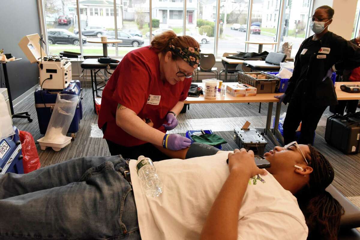 Jakiem Walden, 16, co-coordinator of a Red Cross blood drive at Albany High School, has his blood drawn for donation on Wednesday morning, Nov. 30, 2022, at Albany High School in Albany, N.Y. Albany High is participating in a Red Cross program called "Sickle Cell Fighter High School Scholarship Program." The program encourages more Black donors in an effort to diversify the blood supply and help those who have Sickle Cell Disease.