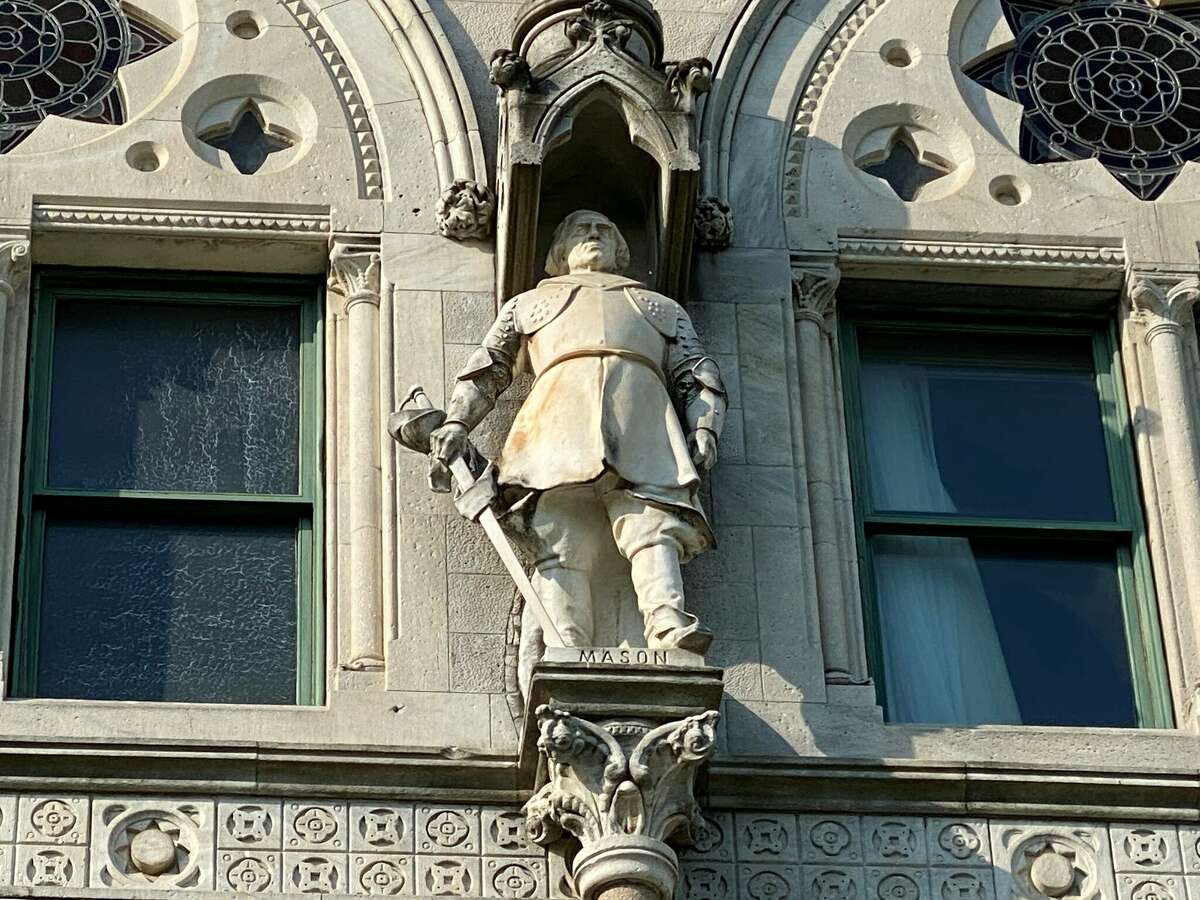The 3,000-pound statue of John Mason, who led the massacre of hundreds of Pequots during the 1637 Battle of Mystic, overlooks Bushnell Park from the third floor exterior niche in the State Capitol.