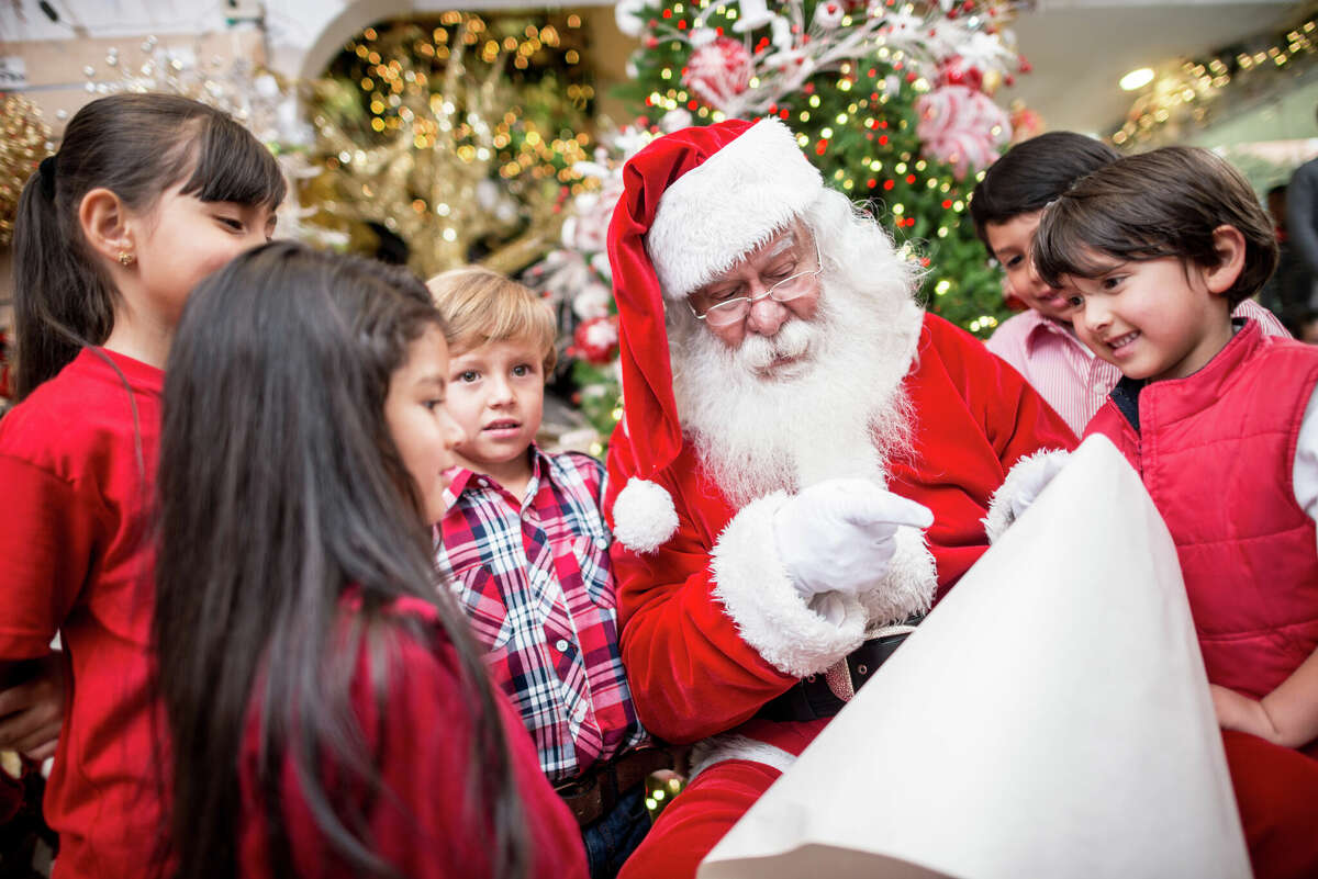 Group of kids with Santa holding a list
