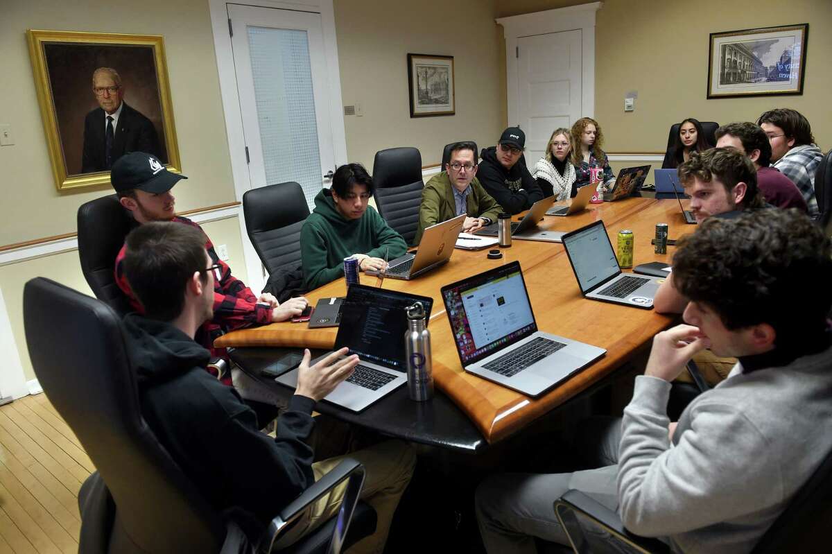 Mark Tavern, center, moderates a social media audit with students for the student-run record label, Rein Records, at Maxcy Hall at the University of New Haven in West Haven.