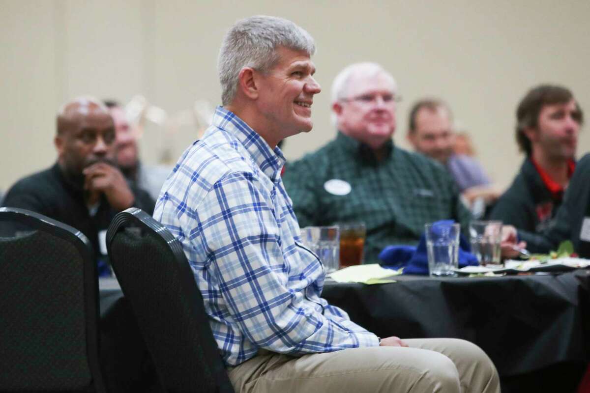 College Park head coach Clifton McNeely listens to Montgomery head coach Don Johnson speak about the upcoming regular season during the Conroe Noon Lions Club’s annual Roundball Roundup with area boys basketball coaches at the Lone Star Convention & Expo Center, Wednesday, Nov. 30, 2022, in Conroe.
