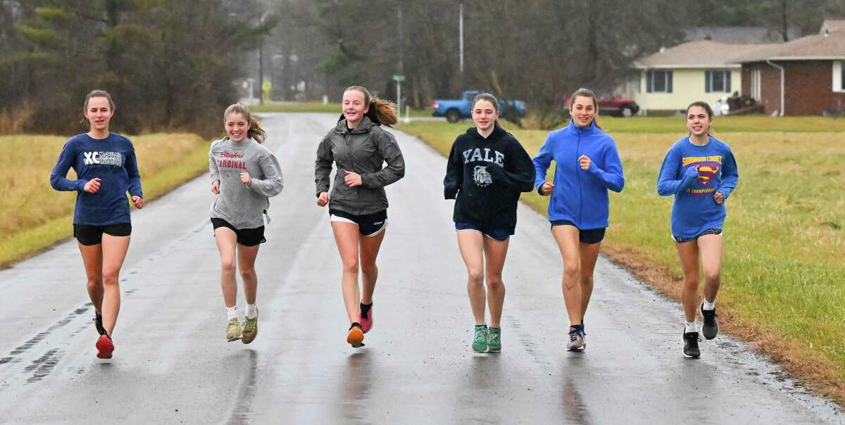 The Bethlehem girls cross country team from left: Annie Bolke, Anna Chrapowitzky, Rylee Davis, Charlotte O’Meara, Sarah Guyette and Olivia Deer run near the high school on Wednesday, Nov. 30, 2022. Not pictured is Katherine Bannigan. The team was preparing for the Nike Cross Nationals in Portland, Oregon, at the Bethlehem High School in Bethlehem, NY. (Jim Franco/Times Union)