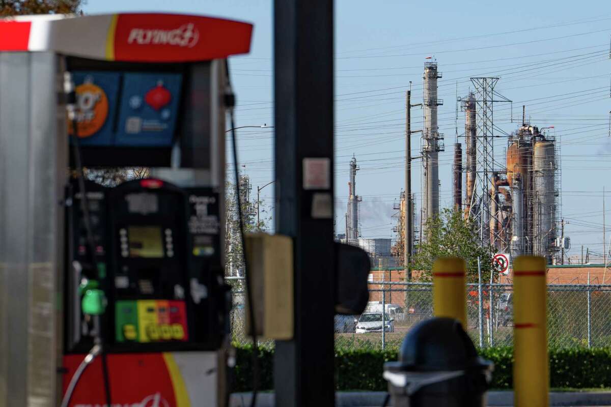 Gas is for sale in the shadow of the numerous petrochemical facilities lining the Houston Ship Channel east of downtown, Wednesday, Nov. 30, 2022.