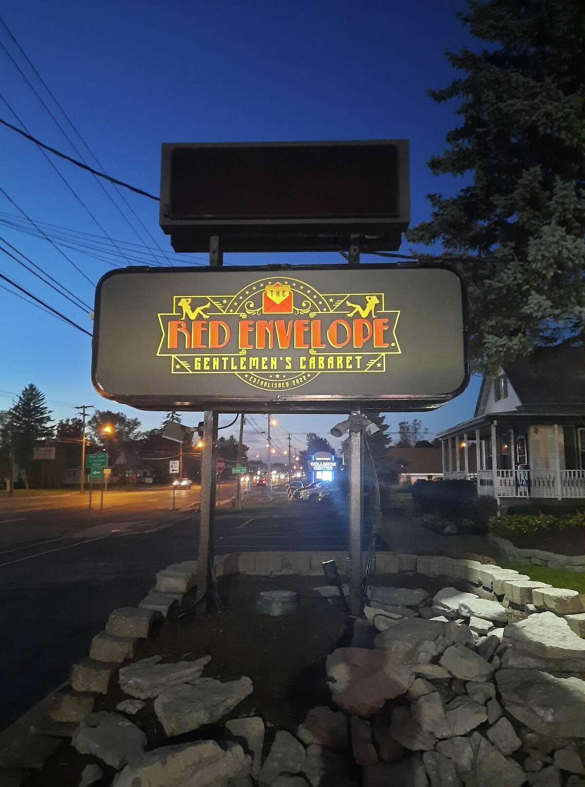 A new sign and upgraded landscaping announce The Red Envelope, a strip bar taking over the former location of DiCarlo's Gentlemen's Club in Colonie. The Red Envelope opens Dec. 1, 2022.