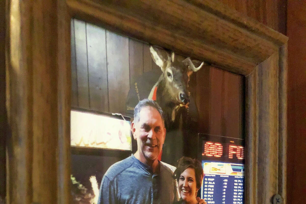 A framed photo of Bruce Bochy that hangs inside Mauna Loa near the stuffed buck's head that he donated to the bar. 