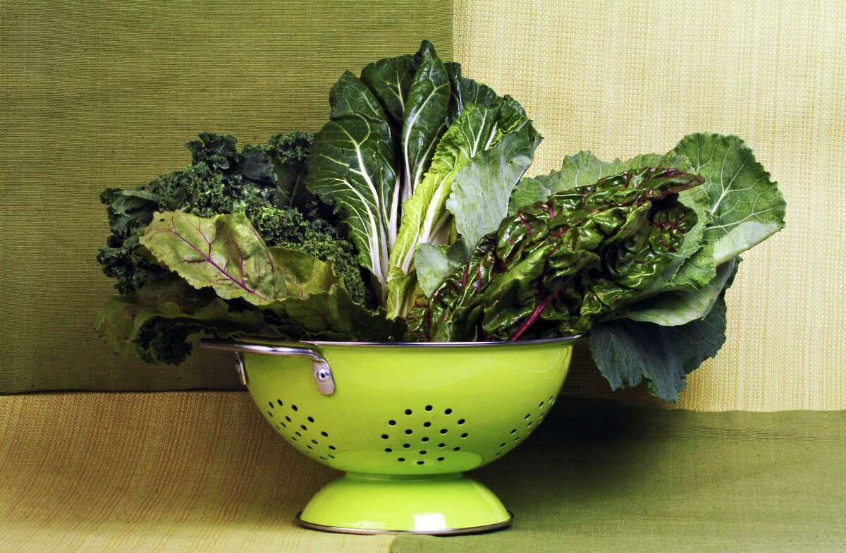 A bowl full of leaves, such as beet greens, chard, kale, collard and bok choy, are greens you can use instead of spinach. (Yalonda M. James/Charlotte Observer/MCT)