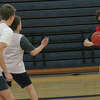 Big Rapids Jack Ruggles (right) looks to make a pass during Wednesday's basketball practice.