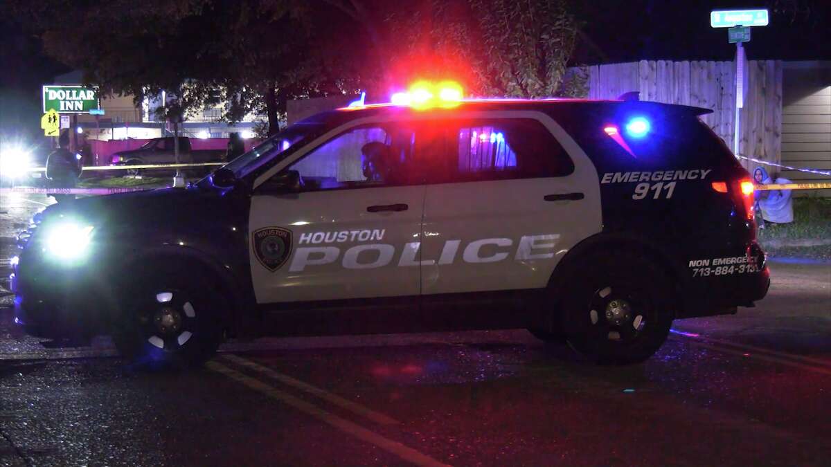 A police car sits near the scene of a fatal hit-and-run in south Houston.