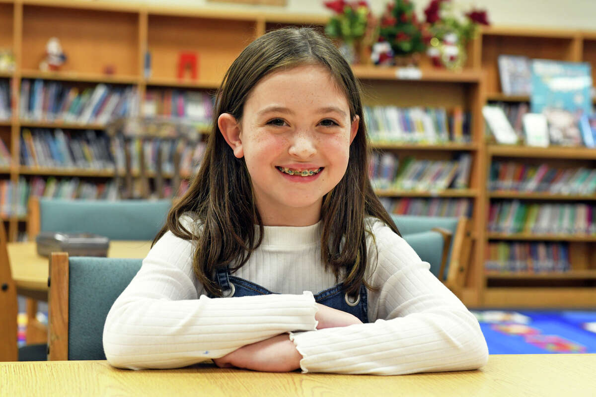 Liliana Magazine, a fifth grader at Meadowside Elementary School, poses during an interview in Milford, Conn. Nov. 30, 2022. Magazine has been appointed to The Connecticut Democracy Center’s 2023 Kid Governor Cabinet.