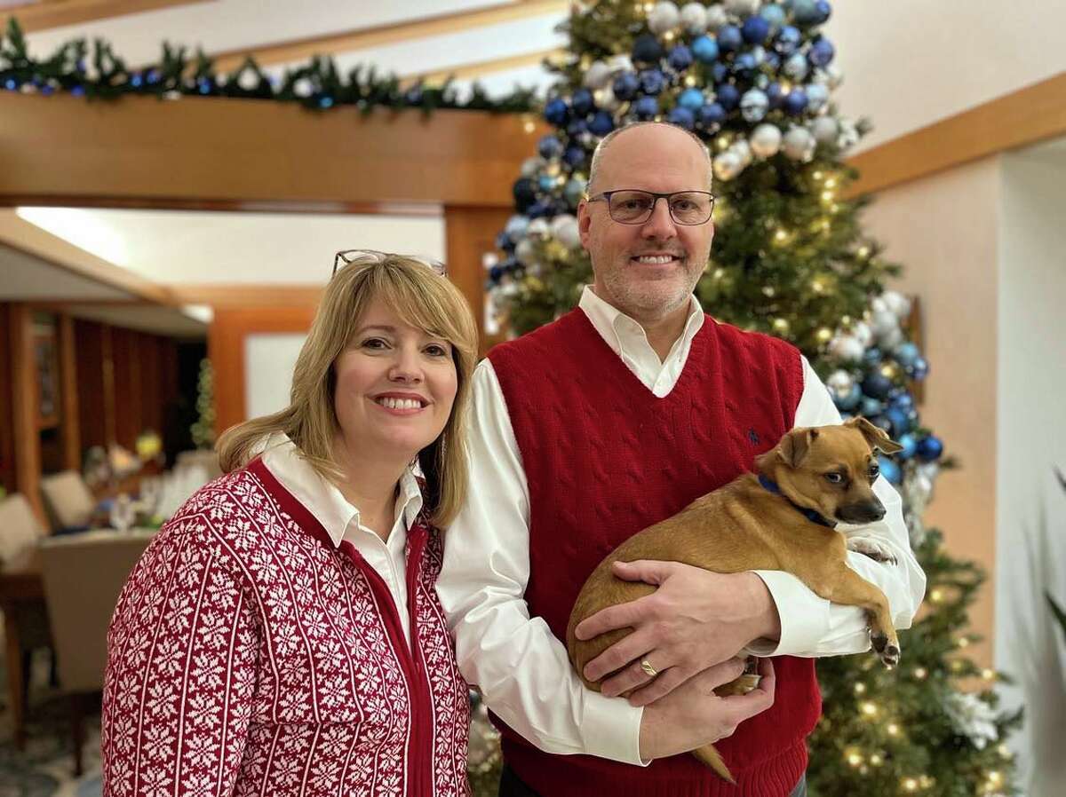 Bridgit and Joe Sova pose with their dog, Skeeter, in their home on Nov. 29, 2022. Their residence will be one of five houses featured in the Zonta Club Homewalk on Dec. 3-4, 2022.