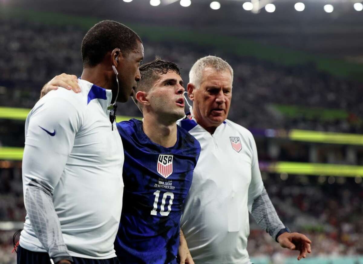 Christian Pulisic of the United States is injured during the Group B match between Iran and the United States at the 2022 FIFA World Cup at Al Thumama Stadium in Doha, Qatar, Nov. 29, 2022.