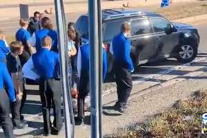 Gladwin band helps stalled motorist on way to football championship game in Detroit