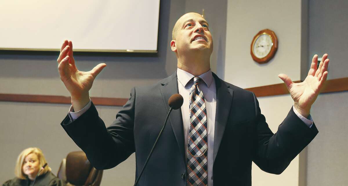 John Badman|The Telegraph Former Alton Police Chief Marcos Pulido talks to the crowd Thursday morning in the Madison County Board Room in Edwardsville after taking the oath of office to be the new Madison County Chief Deputy.