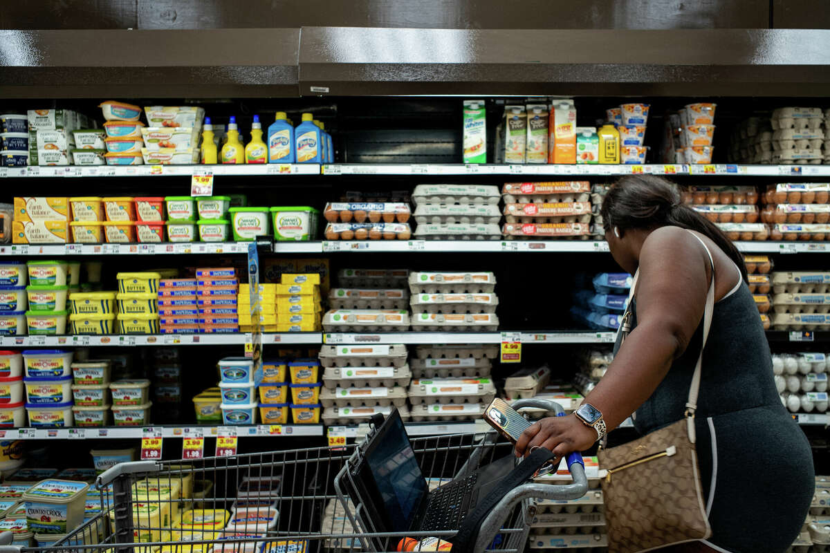 A customer shops for eggs in a Kroger grocery store on Aug. 15, 2022, in Houston, Texas. Food prices have stayed their inflationary course.