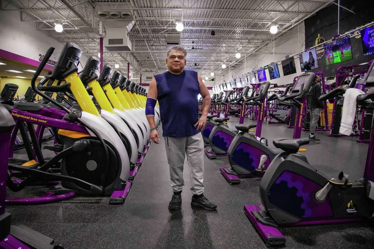Manny Cortez, 51, exercises at Planet Fitness on Wednesday, Nov. 30, 2022, in Houston. Manny has had a hip issue and gained significant weight, at 230 lbs, his doctor told him he needed to lose weight before being able to get a hip replacement surgery. One year later, through exercising at Planet Fitness, he is down to 184 and ready for surgery soon.