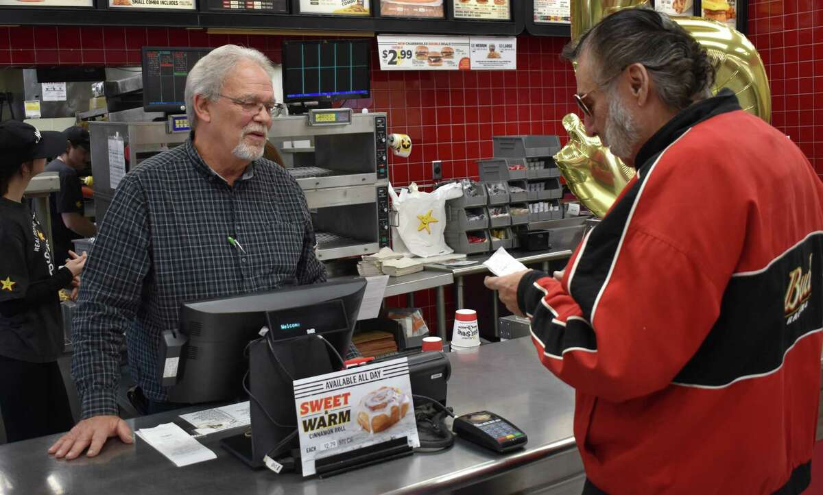 Meeting customers is one of the favorite parts of the job for Dennis Hayes, who has worked for Hardee's in Jacksonville for 50 years. Hayes celebrated his golden anniversary with the company on Thursday. His employer and employees presented him with cards, gifts and a cake.