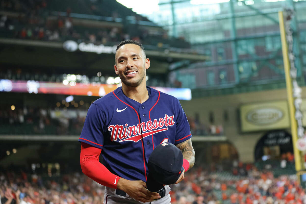 Carlos Correa #4 of the Minnesota Twins walks out of the dugout in his first visit back to Minute Maid Park to face the Houston Astros on August 23, 2022 in Houston, Texas. (Photo by Carmen Mandato/Getty Images)