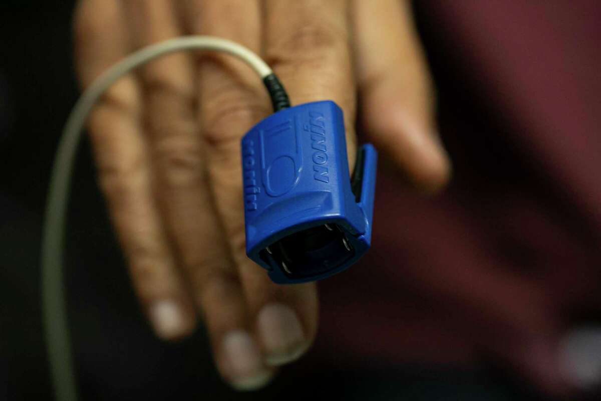 A pulse oximeter connected  Ronald Young’s digit  measures his blood-oxygen level   astatine  Roots Community Health Center successful  Oakland, Calif., connected  Wednesday, Nov. 30, 2022. The nonprofit says the instrumentality  whitethorn  beryllium  partially liable  for troubling disparities that person  Alameda County’s Black residents dying from COVID astatine  doubly  the complaint   of achromatic  residents.