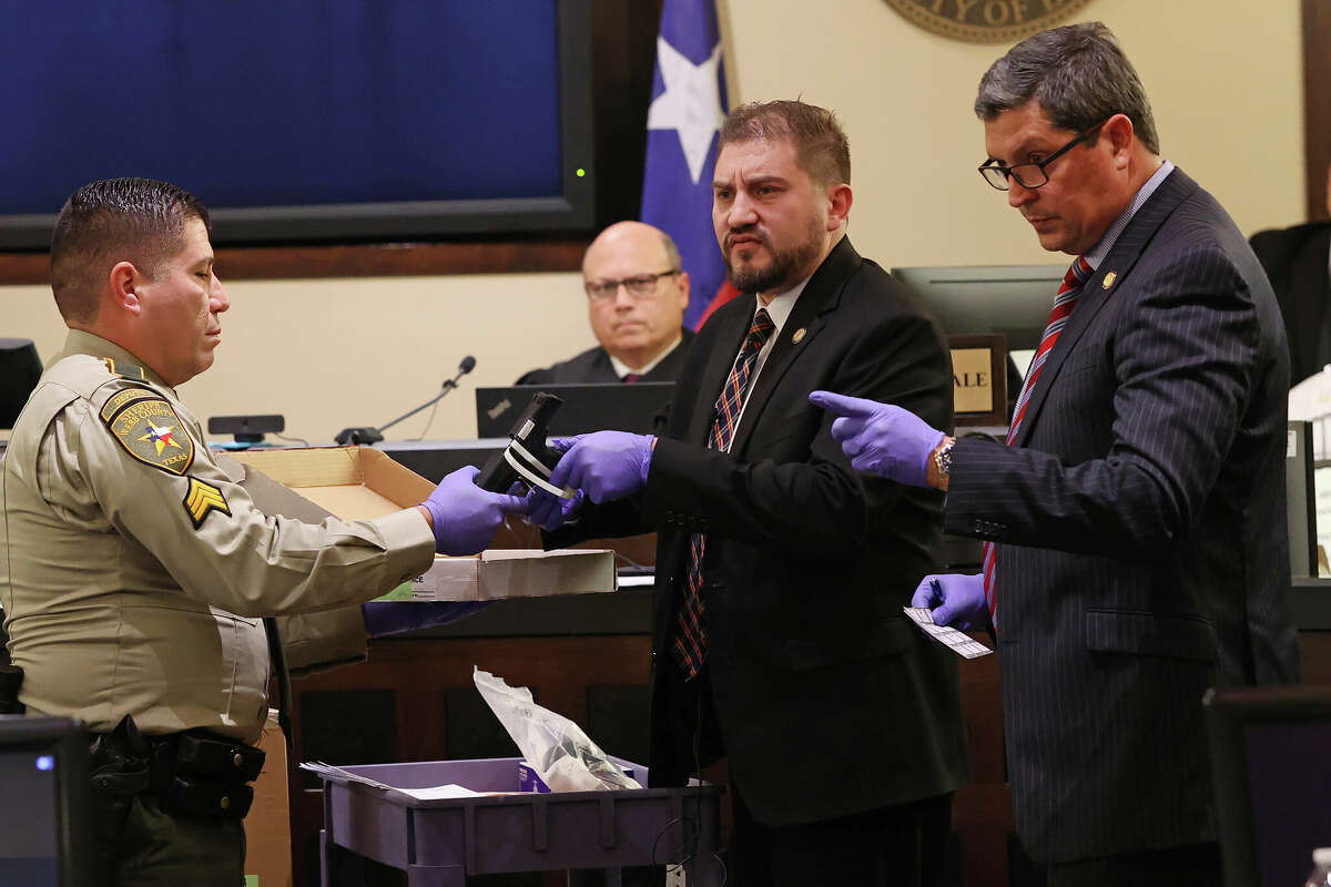 Webb County District Attorney, Isidro R. "Chilo" Alaniz, right, with former lead prosecutor Joshua Davila, center, on day three of former U.S. Border Patrol supervisor Juan David Ortiz's capital murder trial, Tuesday, Nov. 29, 2022. Davila was not seen in court on Thursday after he quit suddenly. "I have officially left the Webb County District Attorney's office. That is the most unprofessional and toxic work place I've ever had to deal with. I do not recommend it. I'm sorry to anyone I let down," Davila wrote on Facebook.