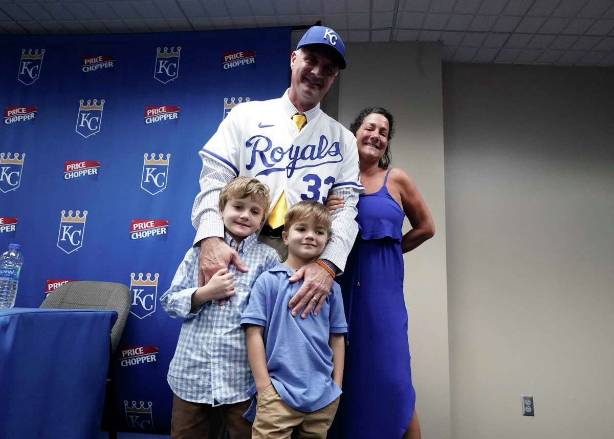 Manager Matt Quatraro of the Kansas City Royals poses with his sons George and Leo, and his wife, Chris, after he was introduced as new manager at Kauffman Stadium on Nov. 3, 2022 in Kansas City, Mo.