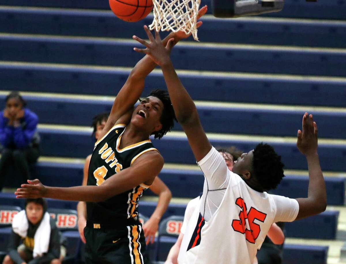 Fort Bend Marshall forward Naheim Northern (4) is fouled as he shoots against Seven Lakes center Josh Akpovwa (35) in the fourth quarter of a non-district high school basketball game at Seven Lakes High School, Thursday, Dec. 1, 2022, in Katy.