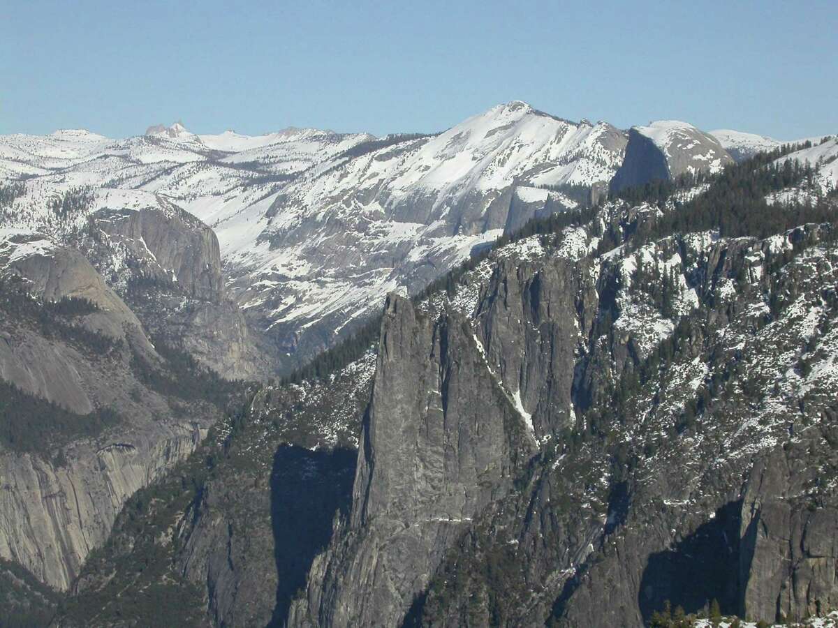 From the south rim atop Yosemite Valley, looking east provides a panorama across Cathedral Rocks, Half Dome and Clark Range.