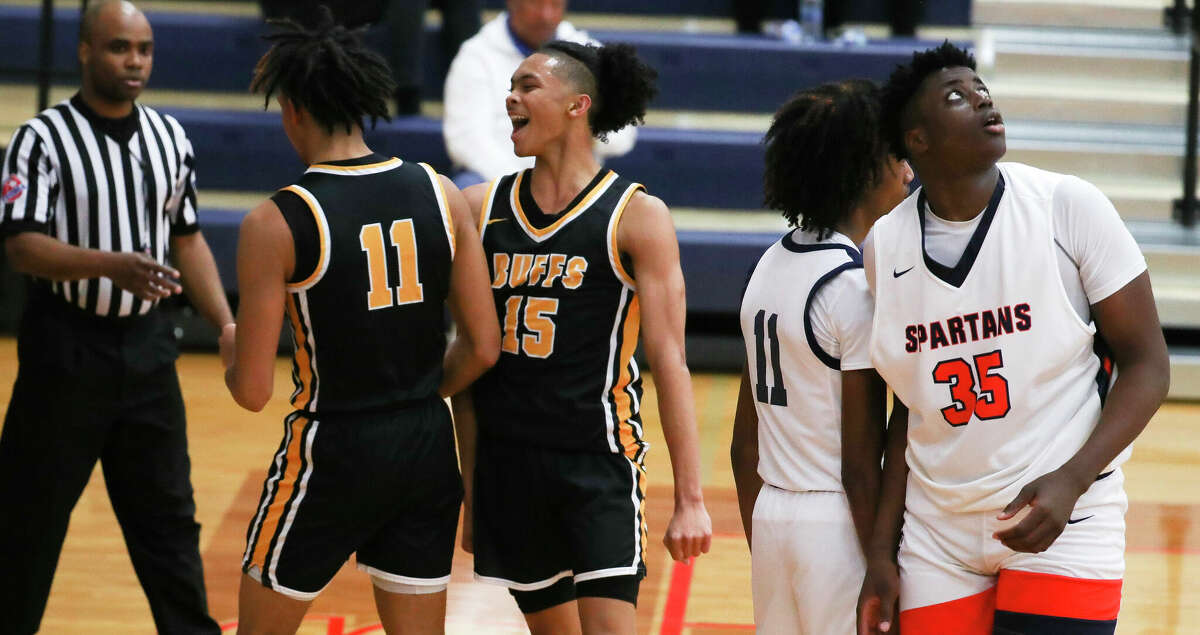 Fort Bend Marshall guard Jaland Lowe (15) reacts after guard Jaylen Reedus made a basket and drew a foul in the fourth quarter of a non-district high school basketball game at Seven Lakes High School, Thursday, Dec. 1, 2022, in Katy.
