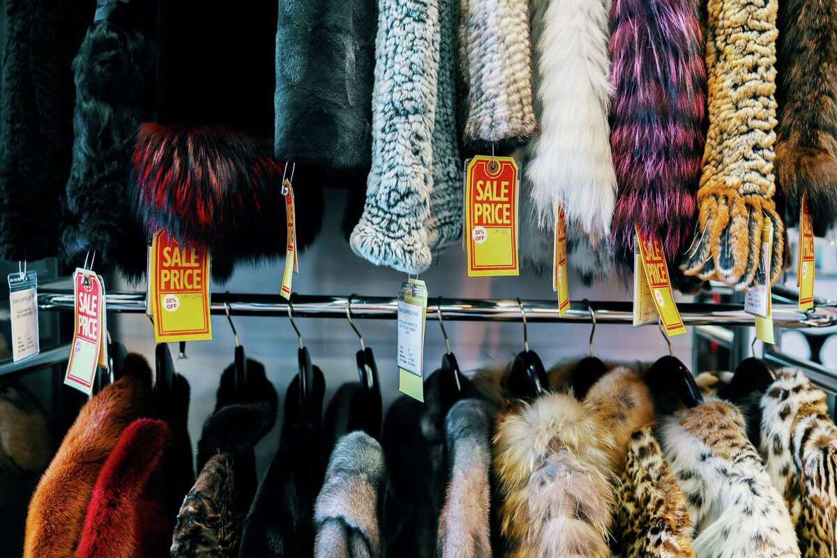 Clothing lines the walls of Beverly Hills fur retailer David Appel on July 17, 2019. Here are 14 new California laws that take effect starting in 2023. Fashionistas will no longer be able to buy new mink coats or chinchilla vests in California beginning in 2023. Retailers can still sell secondhand fur clothing or decor.