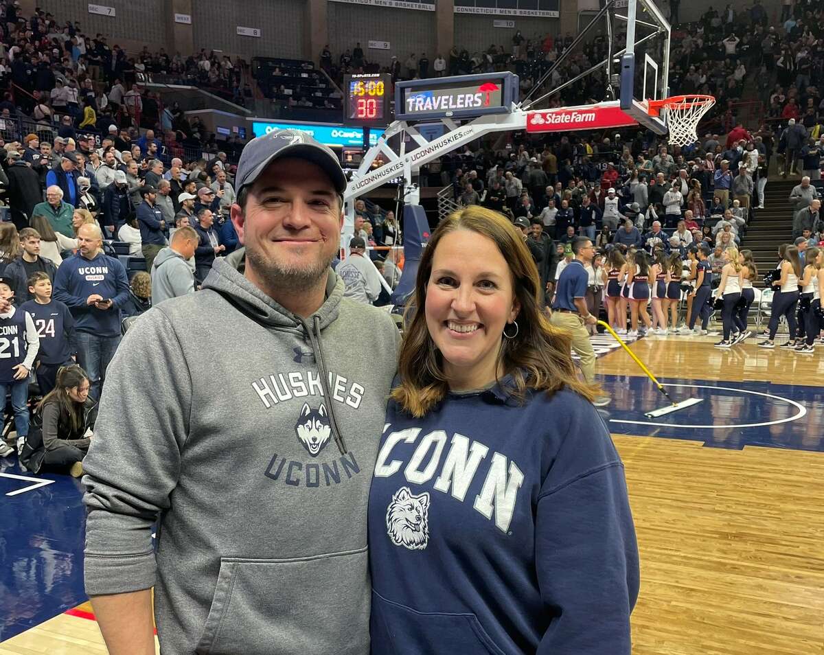 Rob and Megan Babcock, of Tolland, had their seats at Thursday's UConn's men's basketball game upgraded through a Twitter contest conducted by Marc D'Amelio. (Twitter/@UConnMeg22)