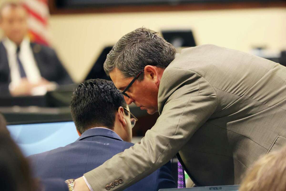 Webb County District Attorney Isidro R. “Chilo” Alaniz, right, talks with assistant prosecutor Rogelio Soto during the capital murder trial of former U.S. Border Patrol supervisor Juan David Ortiz on Friday. Ortiz is accused of killing four women in Laredo in September 2018.