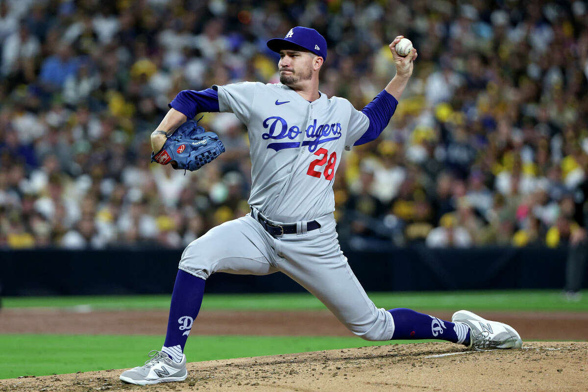 Andrew Heaney #28 of the Los Angeles Dodgers delivers a pitch against the San Diego Padres during the third inning in game three of the National League Division Series at PETCO Park on October 14, 2022 in San Diego, California.