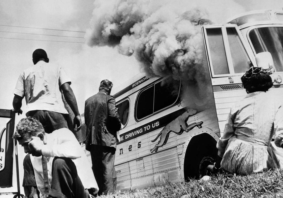 Freedom riders escape a burning Greyhound on May 14, 1961, after a mob set it on fire. In the aftermath, 12-year-old Janie Forsyth brought buckets of water and comfort to the passengers. When faced with hate, we must act.
