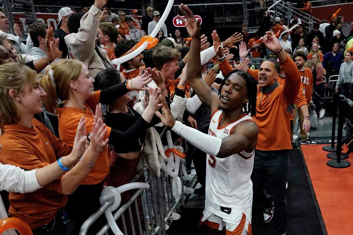Texas guard Marcus Carr (5) celebrates with fans after the team's win over Creighton in an NCAA college basketball game in Austin, Texas, Thursday, Dec. 1, 2022. (AP Photo/Eric Gay)