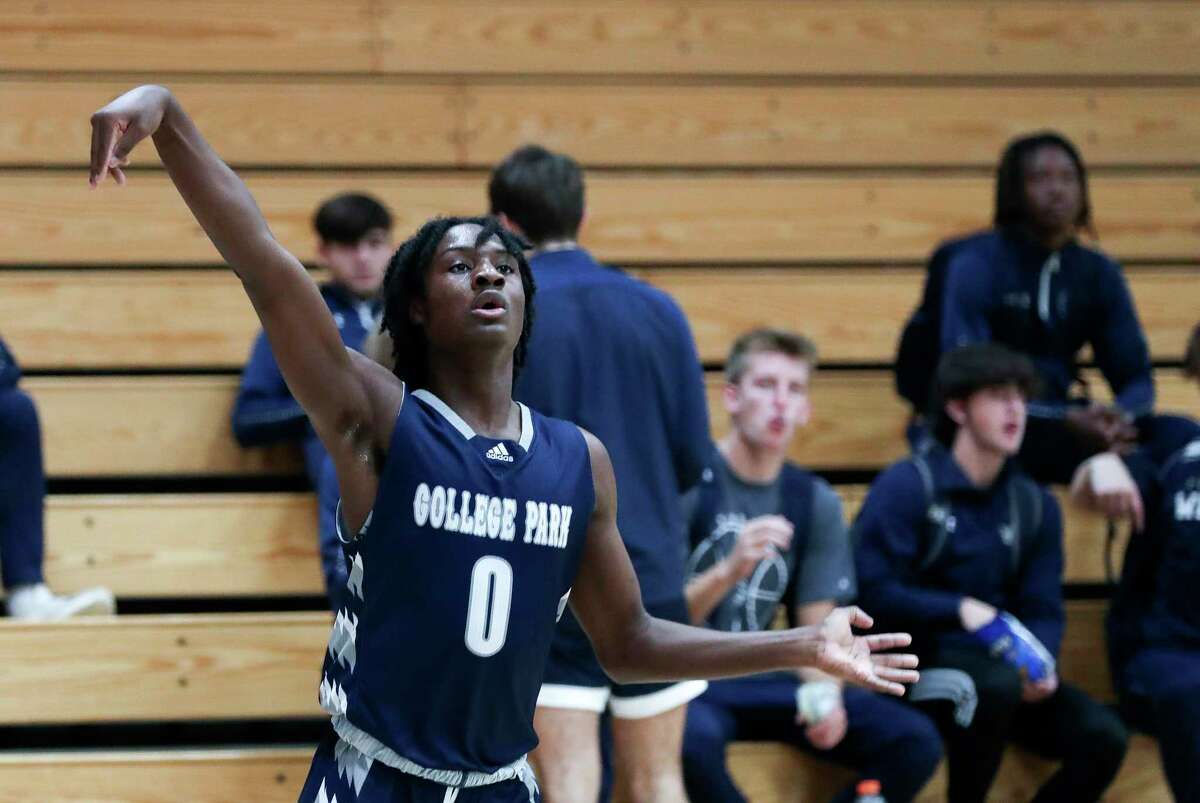 College Park guard Dalyn Johnson (0) holds his 3-point shot in the first quarter of a non-district high school basketball game at Grand Oaks High School, Friday, Dec. 2, 2022, in Spring.