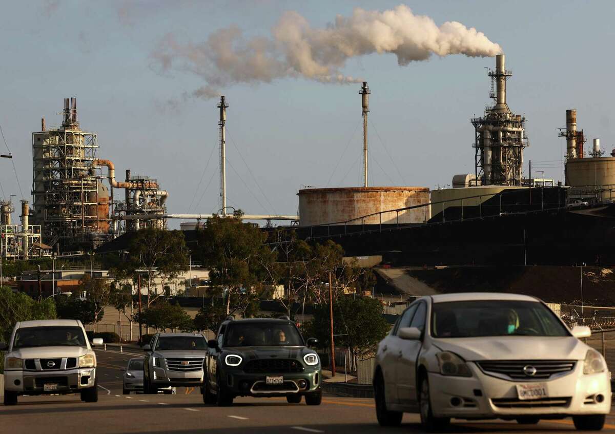 Vehicles pass the Phillips 66 Los Angeles Refinery Wilmington Plant in November in Wilmington (Los Angeles County).