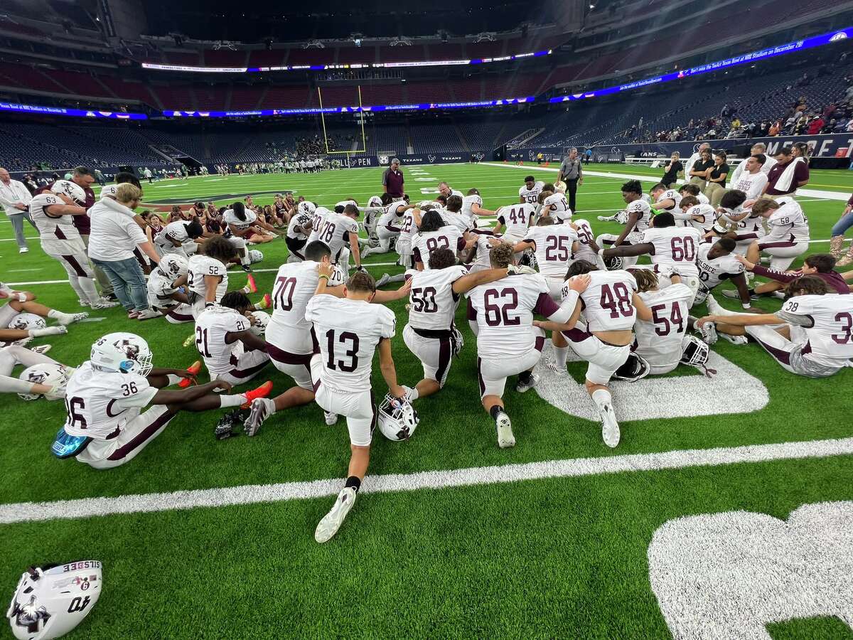 The Silsbee football team gathers after a 58-56 loss to Cuero at NRG Stadium in Houston.