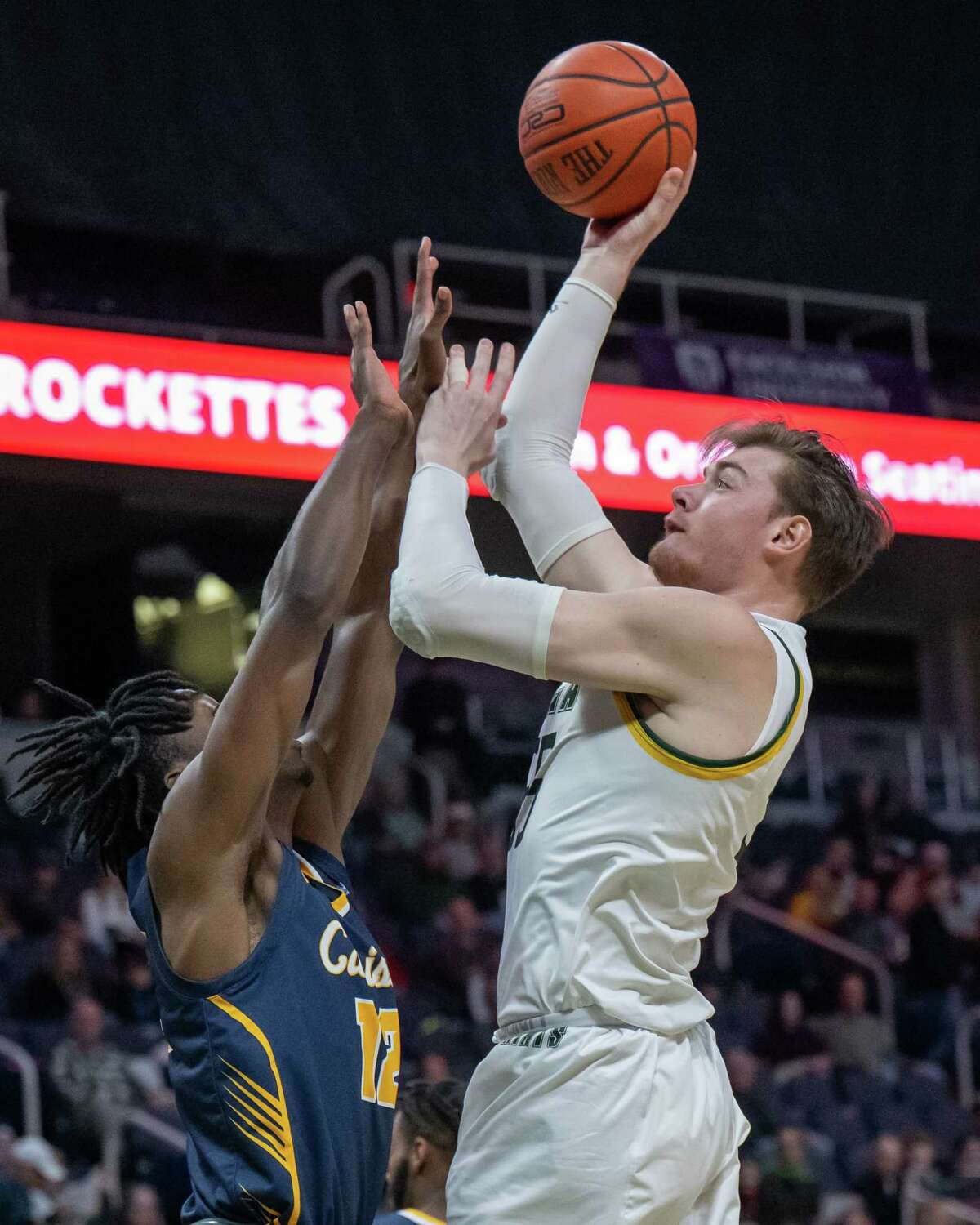 Siena graduate student Jackson Stormo takes a jump hook over Canisius junior Bryce Okpoh during the Metro Atlantic Athletic Conference opener on Friday, Dec. 2, 2022, at the MVP Arena in Albany, N.Y. (Jim Franco/Times Union)
