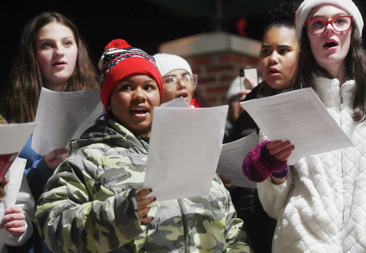 The Shelton Intermediate School choir perform holiday favorites at the annual tree lighting at Veterans Park in Shelton, Conn. on Friday, Dec. 2, 2022.
