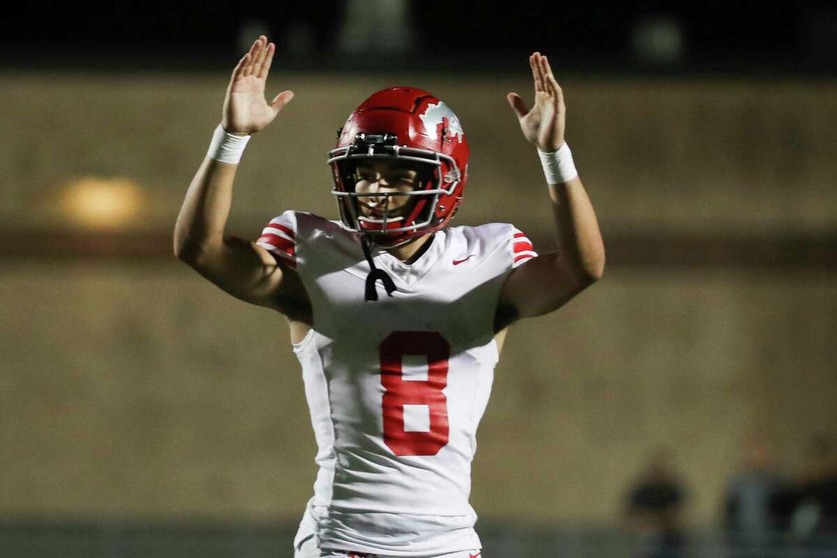 North Shore quarterback David Amador (8) reacts after connecting with wide receiver Kaleb Thomas for a 15-yard touchdown in the fourth quarter of a Region III-6A Division I state quarterfinal game at Randall Reed Stadium, Friday, Dec. 2, 2022, in New Caney.