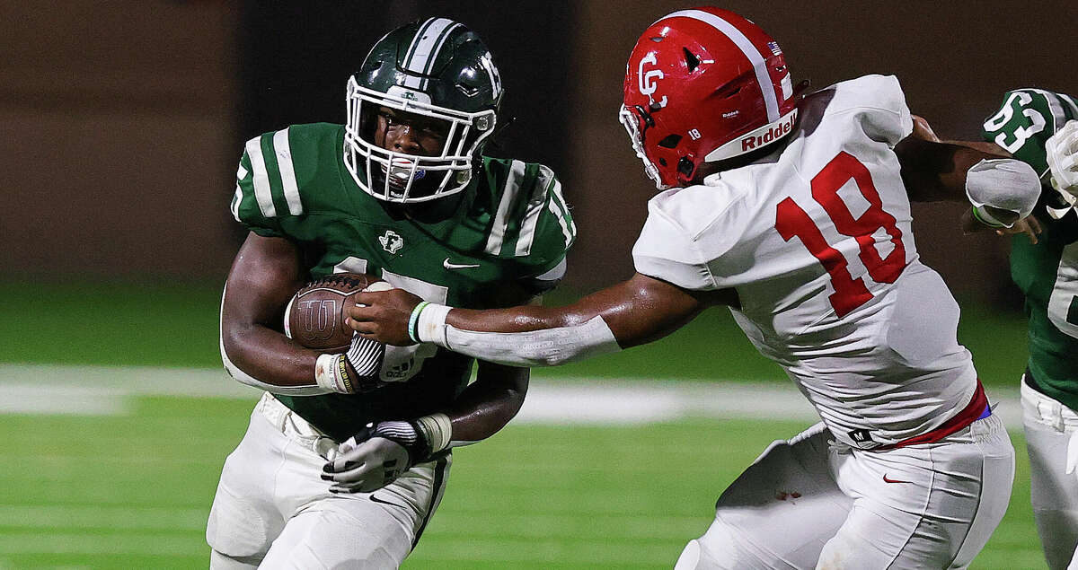 HOUSTON, TX -DECEMBER 2: Franklin half back Bryson Washington(15) rushes with the ball against Columbus defensive lineman Devin Woods (18) during a Region III-3A Division I championship game between Columbus and Franklin December 2, 2022 at Tomball ISD Stadium in Tomball, Texas.