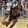 Edwardsville's Malik Allen drives to the basket against Alton in a Southwestern Conference matchup on Friday night. Allen scored a career-high 20 points in the Tigers 59-42 win. 