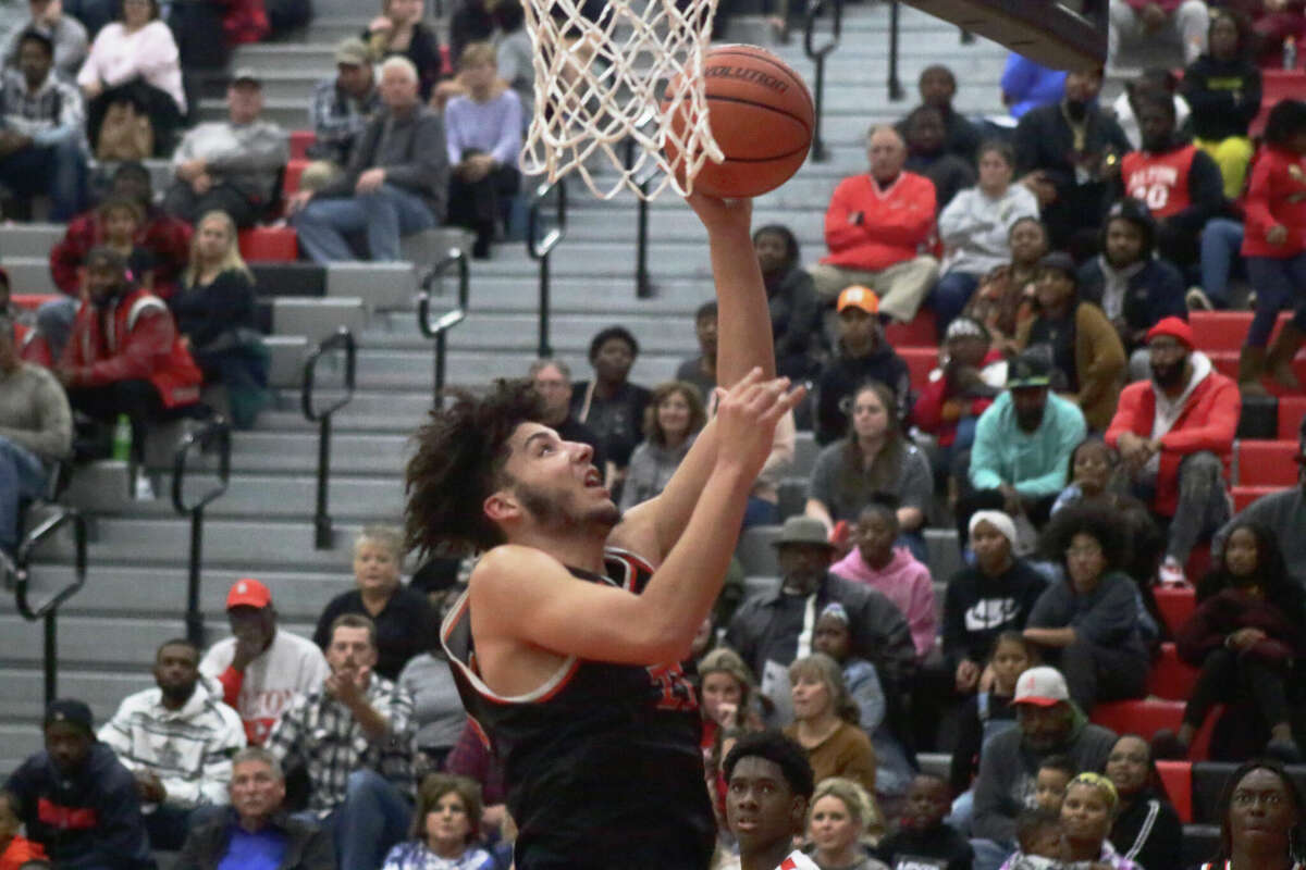 Edwardsville's Isayah Kloster rises for a layup against Alton in a Southwestern Conference matchup on Friday night. Kloster scored 12 points in the Tigers 59-42 win. 